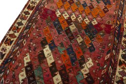 Backside of handmade 2000s Shiraz rug showing knot structure and weave density