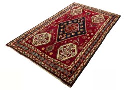 Corner detail of 2000s Shiraz rug showing border pattern and Wool pile