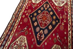 Backside of handmade 2000s Shiraz rug showing knot structure and weave density
