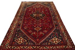 Surface texture of 2000s Shiraz rug with natural Wool and intricate pattern