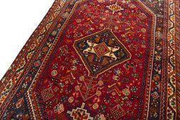 Backside of handmade 2000s Shiraz rug showing knot structure and weave density