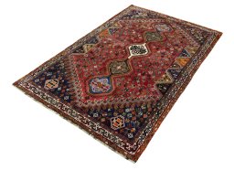 Corner detail of 2000s Shiraz rug showing border pattern and Wool pile