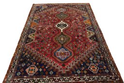 Surface texture of 2000s Shiraz rug with natural Wool and intricate pattern