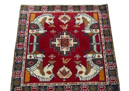 Surface texture of 2000s Shiraz rug with natural Wool and intricate pattern