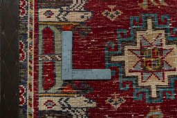 Backside of handmade 2000s Shiraz rug showing knot structure and weave density