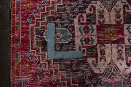 Backside of handmade 2000s Shiraz rug showing knot structure and weave density