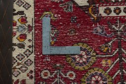 Backside of handmade 2000s Shiraz rug showing knot structure and weave density