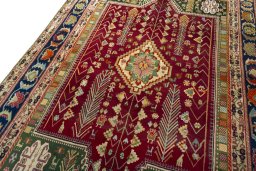 Backside of handmade 2000s Shiraz rug showing knot structure and weave density