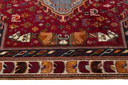 Corner detail of 2000s Shiraz rug showing border pattern and Wool pile
