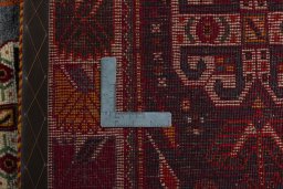Backside of handmade 2000s Shiraz rug showing knot structure and weave density