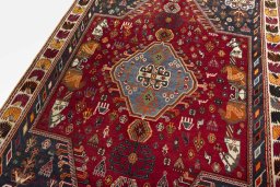 Backside of handmade 2000s Shiraz rug showing knot structure and weave density