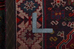 Surface texture of 2000s Shiraz rug with natural Wool and intricate pattern