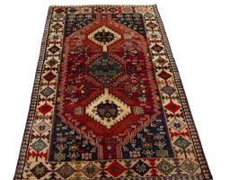 Surface texture of 2000s Shiraz rug with natural Wool and intricate pattern