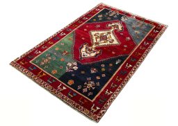Corner detail of 2000s Shiraz rug showing border pattern and Wool pile