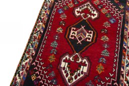 Backside of handmade 2000s Shiraz rug showing knot structure and weave density