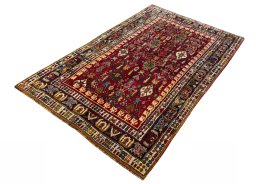 Corner detail of 2000s Shiraz rug showing border pattern and Wool pile