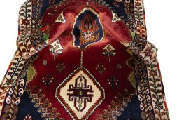 Corner detail of 2000s Shiraz rug showing border pattern and Wool pile