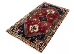 Corner detail of 2000s Shiraz rug showing border pattern and Wool pile