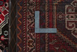 Surface texture of 2000s Shiraz rug with natural Wool and intricate pattern