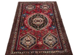 Surface texture of 2000s Shiraz rug with natural Wool and intricate pattern