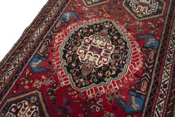 Backside of handmade 2000s Shiraz rug showing knot structure and weave density