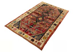 Corner detail of 2000s Shiraz rug showing border pattern and Wool pile