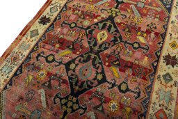 Backside of handmade 2000s Shiraz rug showing knot structure and weave density