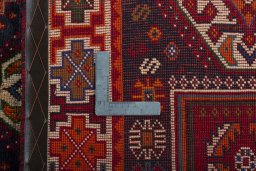 Surface texture of 2000s Shiraz rug with natural Wool and intricate pattern