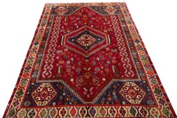 Surface texture of 2000s Shiraz rug with natural Wool and intricate pattern