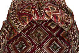 Corner detail of 2000s Shiraz rug showing border pattern and Wool pile