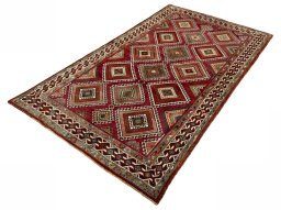 Corner detail of 2000s Shiraz rug showing border pattern and Wool pile