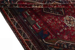 Corner detail of 1970s Shiraz rug showing border pattern and Wool pile