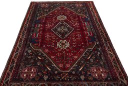 Surface texture of 1970s Shiraz rug with natural Wool and intricate pattern