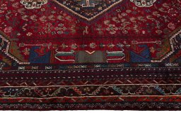 Full view of 1970s Shiraz rug from Iran / Persia, 257 × 175 cm in Red tones