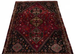 Surface texture of 2000s Shiraz rug with natural Wool and intricate pattern