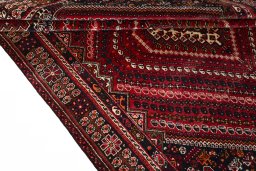 Corner detail of 2000s Shiraz rug showing border pattern and Wool pile