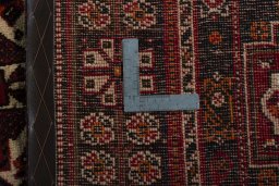 Surface texture of 2000s Shiraz rug with natural Wool and intricate pattern