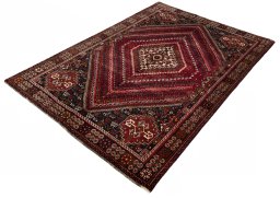Corner detail of 2000s Shiraz rug showing border pattern and Wool pile