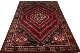 Surface texture of 2000s Shiraz rug with natural Wool and intricate pattern