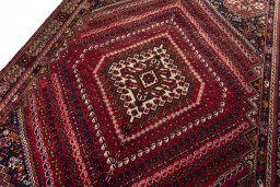 Backside of handmade 2000s Shiraz rug showing knot structure and weave density