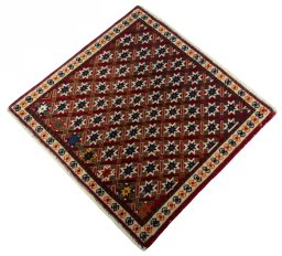 Corner detail of 2000s Shiraz rug showing border pattern and Wool pile