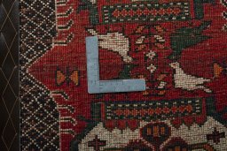 Backside of handmade 2000s Shiraz rug showing knot structure and weave density