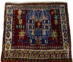 Surface texture of 2000s Shiraz rug with natural Wool and intricate pattern