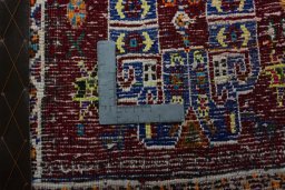 Backside of handmade 2000s Shiraz rug showing knot structure and weave density