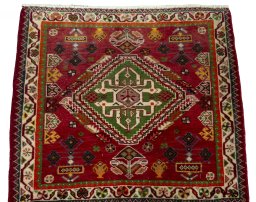 Surface texture of 2000s Shiraz rug with natural Wool and intricate pattern