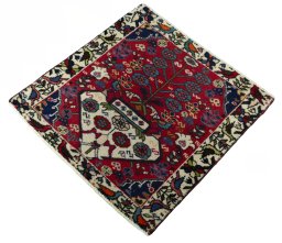 Corner detail of 2000s Shiraz rug showing border pattern and Wool pile
