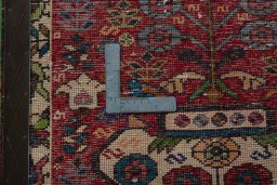 Backside of handmade 2000s Shiraz rug showing knot structure and weave density