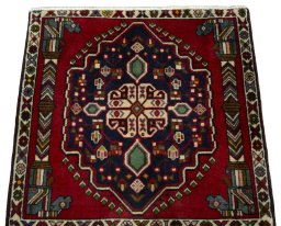 Surface texture of 2000s Shiraz rug with natural Wool and intricate pattern