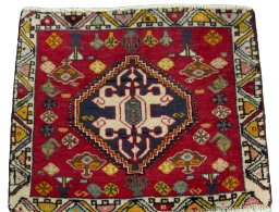 Surface texture of 2000s Shiraz rug with natural Wool and intricate pattern