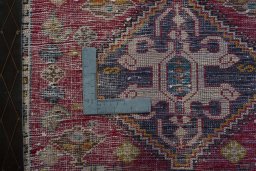 Backside of handmade 2000s Shiraz rug showing knot structure and weave density